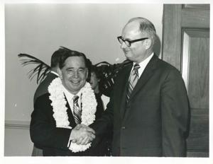 Carl Albert shaking hands with Charles Ward at his birthday party. May 10, 1974, 1974-05-10