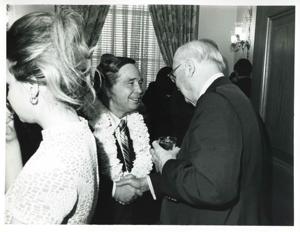Carl Albert shaking hands with an unidentified man at his birthday party. May 10, 1974, 1974-05-10