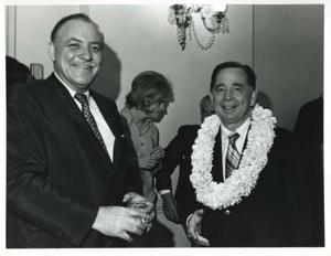 Carl Albert shaking hands with an unidentified man at his birthday party. May 10, 1974, 1974-05-10