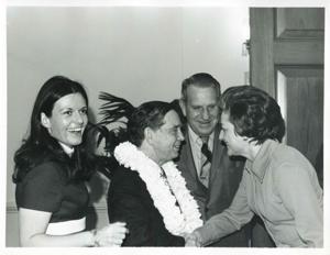 Carl Albert shaking hands with an unidentified woman as John N. Happy Camp looks on. This is at Albert&#39;s birthday party. May 10, 1974, 1974-05-10