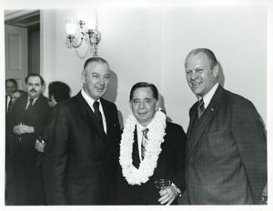 Carl Albert, Gerald R. Ford, and another man posing at Albert&#39;s birthday party. May 10, 1976, 1976-05-10