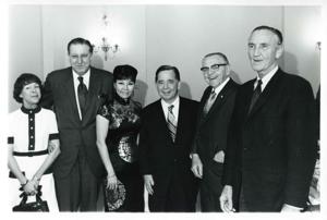 Carl Albert posing with Mary Albert and Mike Mansfield and others at his birthday party. May 10, 1974, 1974-05-10