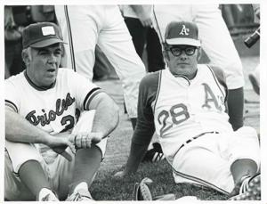 Clem McSpadden and another baseball player seated on the ground., 1950-01-01 - 1976-12-31