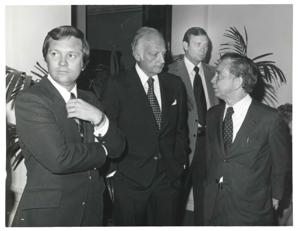 Carl Albert talking with unidentified men at breakfast on May 23, 1973, 1973-05-23