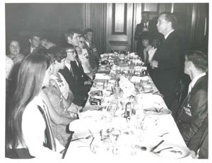 Carl Albert speaking to several people seated at a dinner table., 1950-01-01 - 1976-12-31
