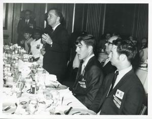 Carl Albert speaking to several people seated at a dinner table., 1950-01-01 - 1976-12-31
