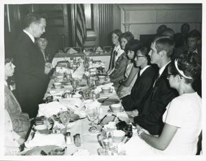 Carl Albert speaking to several people seated at a dinner table., 1950-01-01 - 1976-12-31