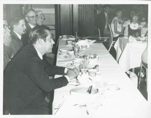 Fred Harris seated at a dinner table., 1950-01-01 - 1976-12-31