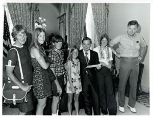 Carl Albert posing with an unidentified family in his office., 1950-01-01 - 1976-12-31