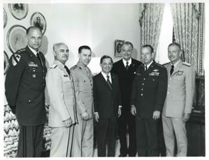 Carl Albert posing with several military officers and Red Skelton, 1950-01-01 - 1976-12-31