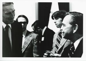 Carl Albert speaking with Charlton Heston as others stand nearby., 1950-01-01 - 1976-12-31
