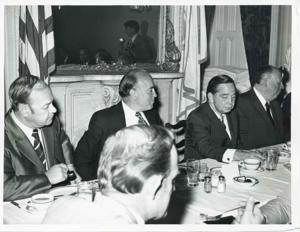 Carl Albert, Gerald R. Ford, and two other men seated at a dinner table., 1950-01-01 - 1976-12-31