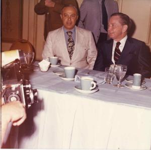 Carl Albert and Robert Strauss seated next to one another at a dinner table., 1950-01-01 - 1976-12-31