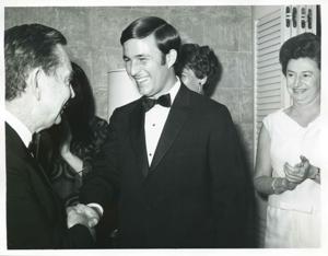 Carl Albert shaking hands with an unidentified man., 1950-01-01 - 1976-12-31