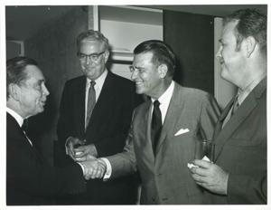 Carl Albert shaking hands with an unidentified man., 1950-01-01 - 1976-12-31