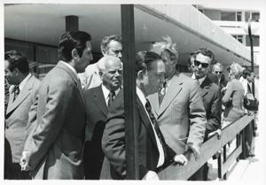 Carl Albert standing outside with several other men. House delegation trip. August 1975, 1975-08-04