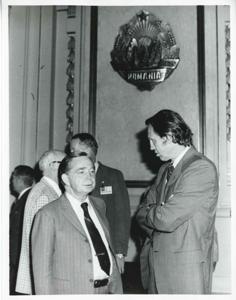 Carl Albert speaking with an unidentified man. House delegation trip. August 1975, 1975-08-04