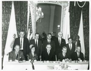 Page Belcher, Ed Edmondson, John Jarman, Victor Wickersham, and Carl Albert standing. A. S. Mike Monroney, Tom Steed, Howard Edmondson, and two unidentified people are seated., 1950-01-01 - 1976-12-31