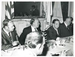 Carl Albert speaking to men seated at a dinner table. Gerald R. Ford is present., 1950-01-01 - 1976-12-31