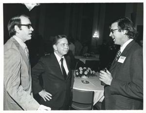 Carl Albert speaking with two unidentified men at the reception for freshman members of the 94th Congress. December 1, 1975, 1975-12-01