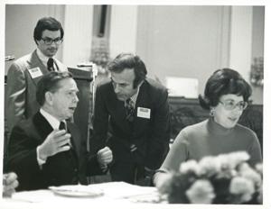 Carl Albert speaking with an unidentified man at the reception for freshman members of the 94th Congress. December 1, 1975, 1975-12-01