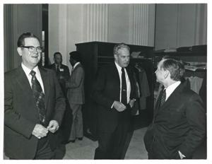 Carl Albert speaking with an unidentified man at the reception for freshman members of the 94th Congress. December 1, 1975, 1975-12-01