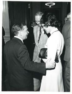 Carl Albert speaking with an unidentified woman at a reception for freshman members of the 94th Congress. December 1, 1975, 1975-12-01