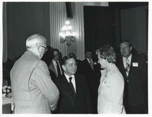 Carl Albert with unidentified people at a reception for freshman members of the 94th Congress. December 1, 1975, 1975-12-01