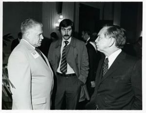 Carl Albert speaking with Olin Teague and another man at a reception of freshman members of the 94th Congress. December 1, 1975, 1975-12-01