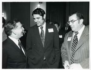 Carl Albert talking with two unidentified men at the reception for freshman members of the 94th Congress. December 1, 1975, 1975-12-01