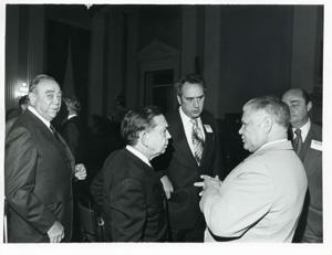 Carl Albert speaking with Olin Teague and others at a reception for freshman members of the 94th Congress. December 1, 1975, 1975-12-01