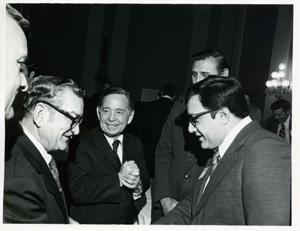 Carl Albert speaking with several unidentified men at a reception for freshman members of the 94th Congress. December 1, 1975, 1975-12-01