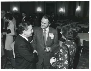 Carl Albert speaking with two unidentified people at a reception honoring freshman members of the 94th Congress. December 1, 1975, 1975-12-01