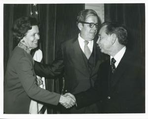 Carl Albert shaking hands with an unidentified woman., 1950-01-01 - 1976-12-31