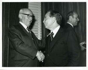 Carl Albert shaking hands with Melvin Price, 1950-01-01 - 1976-12-31