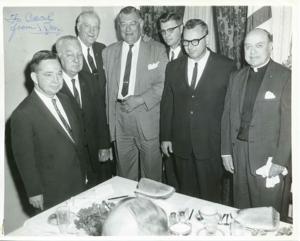 Carl Albert with unidentified men at a steak dinner. August 3, 1964, 1964-08-03