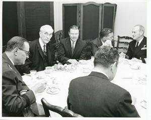 Carl Albert, John W. McCormack, Robert S. McNamara, and others seated at a dinner table., 1967-10-30