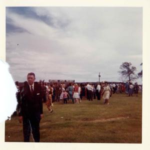John B. Connally, A. S. Mike Monroney, Lady Bird Johnson, Henry Bellmon, Carl Albert, Ed Edmondson, Lyndon B. Johnson, and others at the dedication of the Eufaula Dam and Reservoir by President Johnson. September 25, 1964. a-c additions. Carl Albert at podium, Lyndon B. Johnson at podium, and crowd., 1964-09-25