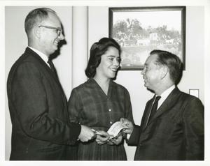 Carl Albert presenting a House of Representatives check to Jean Bain. An unidentified man is also present., 1965-06-11