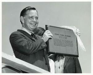 Photos A-C. Carl Albert installing the official road sign for the Carl Albert Parkway in McAlester, Oklahoma., 1950-01-01 - 1976-12-31