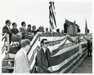 Carl Albert speaking at the Port Carl Albert dedication. John N. Happy Camp, David Hall, and Wilbur D. Mills is also present. May 27, 1972, 1972-05-27