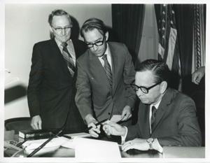 Presentation of $80,000 to Carl Albert for murals in Capitol. Fred Swengel and Gerald R. Ford are also present., 1950-01-01 - 1976-12-31