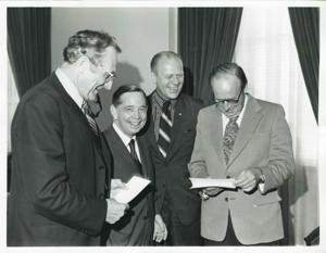 Presentation of $80,000 to Carl Albert for murals in Capitol. Fred Swengel and Gerald R. Ford are also present., 1950-01-01 - 1976-12-31