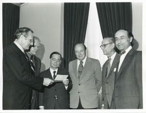 Presentation of $80,000 to Carl Albert for murals in Capitol. Fred Swengel and Gerald R. Ford are also present., 1950-01-01 - 1976-12-31