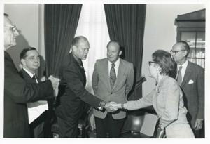 Presentation of $80,000 to Carl Albert for murals in Capitol. Fred Swengel and Gerald R. Ford are also present., 1950-01-01 - 1976-12-31