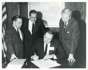 Presentation of $80,000 to Carl Albert for murals in Capitol. Fred Swengel and Gerald R. Ford are also present., 1950-01-01 - 1976-12-31
