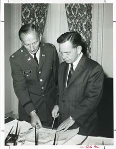 Carl Albert with an unidentified woman viewing a model of an art museum., 1950-01-01 - 1976-12-31