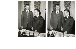 Carl Albert viewing a booklet dealing with Talimena Scenic Drive, with four unidentified men, 1950-01-01 - 1976-12-31