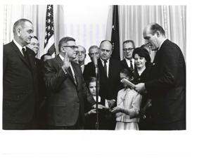 Postmaster General John A. Gronouski is speaking at his swearing-in ceremony. February 19, 1965, 1965-02-19