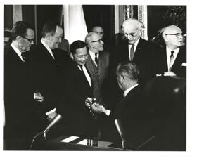 Lyndon B. Johnson, John W. McCormack, Carl Albert, Carl Hayden, and Hale Boggs are walking outdoors. December 10, 1963, 1963-12-10